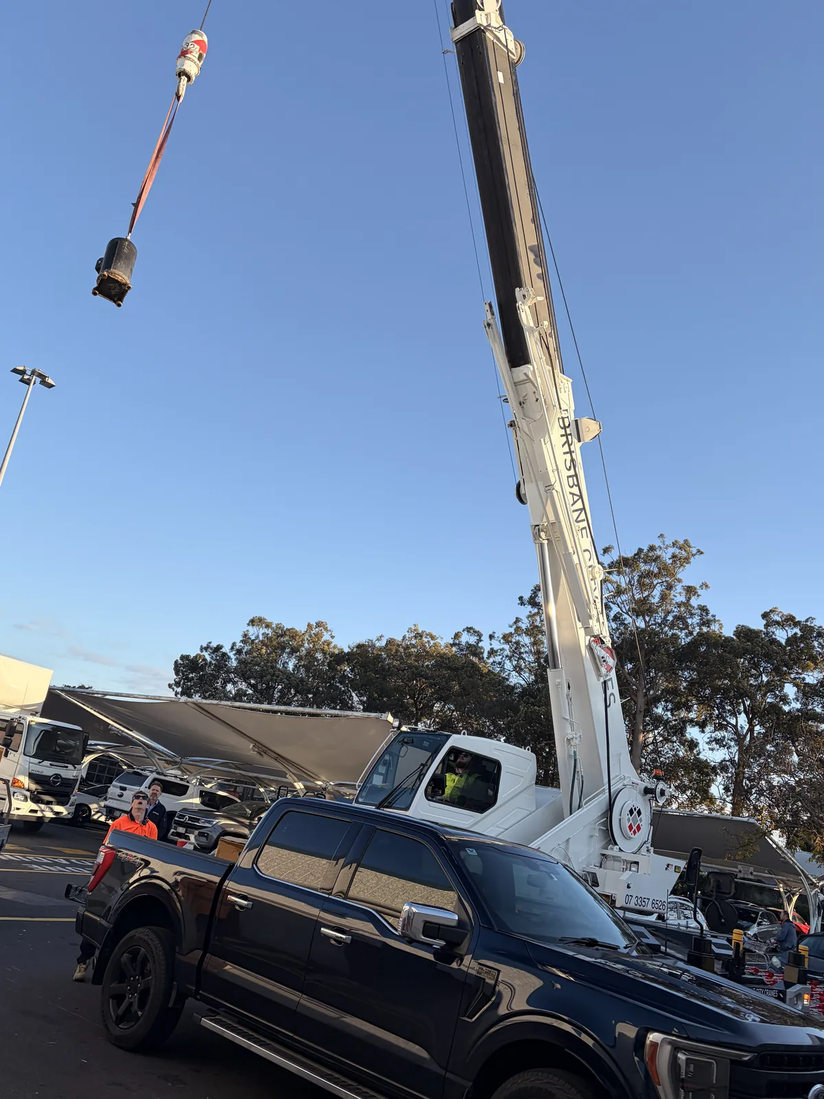 HVAC technician working safely on commercial rooftop equipment